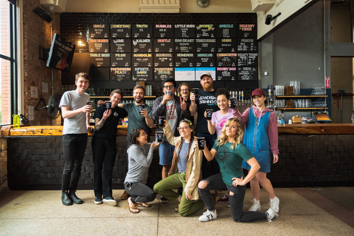 Group at Rhinegeist bar cheersing