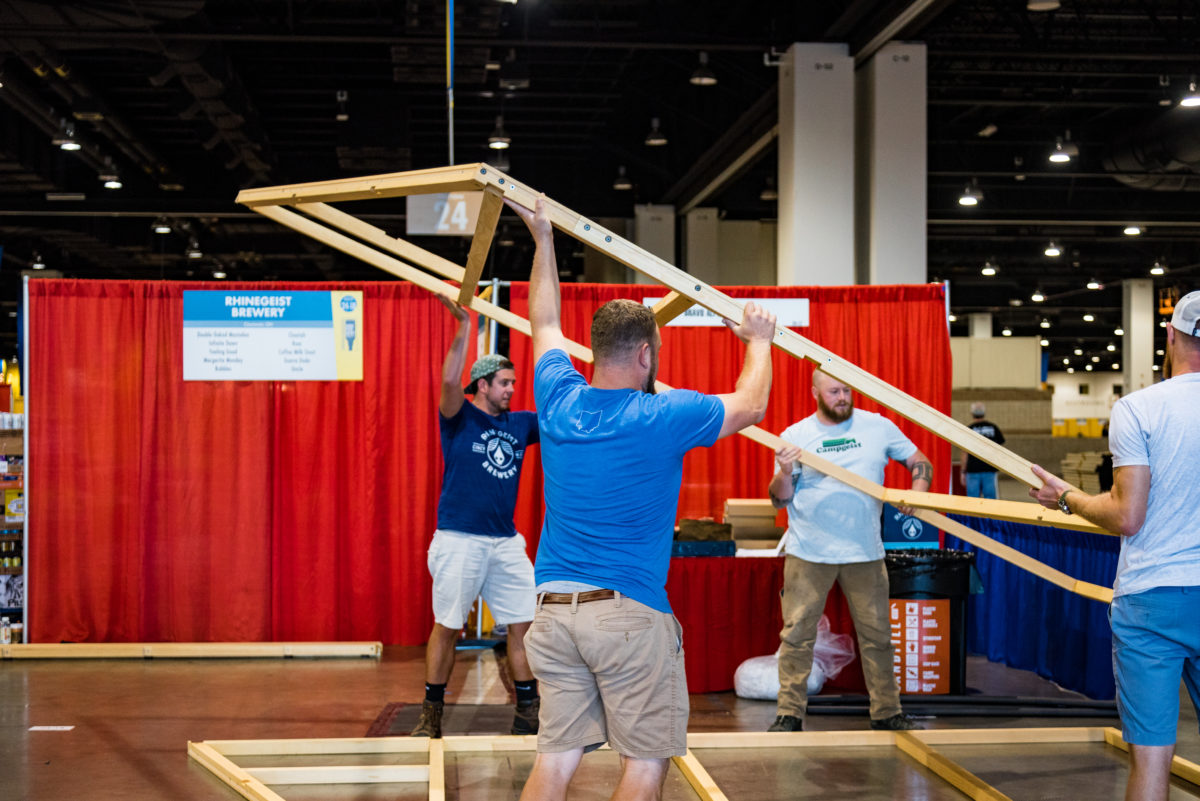 rhinegeist brewery assembling endcap at GABF 2018