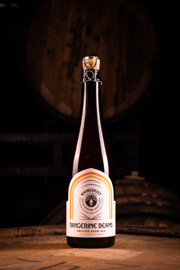 Rhinegeist Tangerine Beams Bottle on Barrel