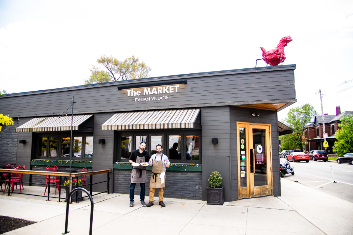 Two chefs outside restaurant in Columbus