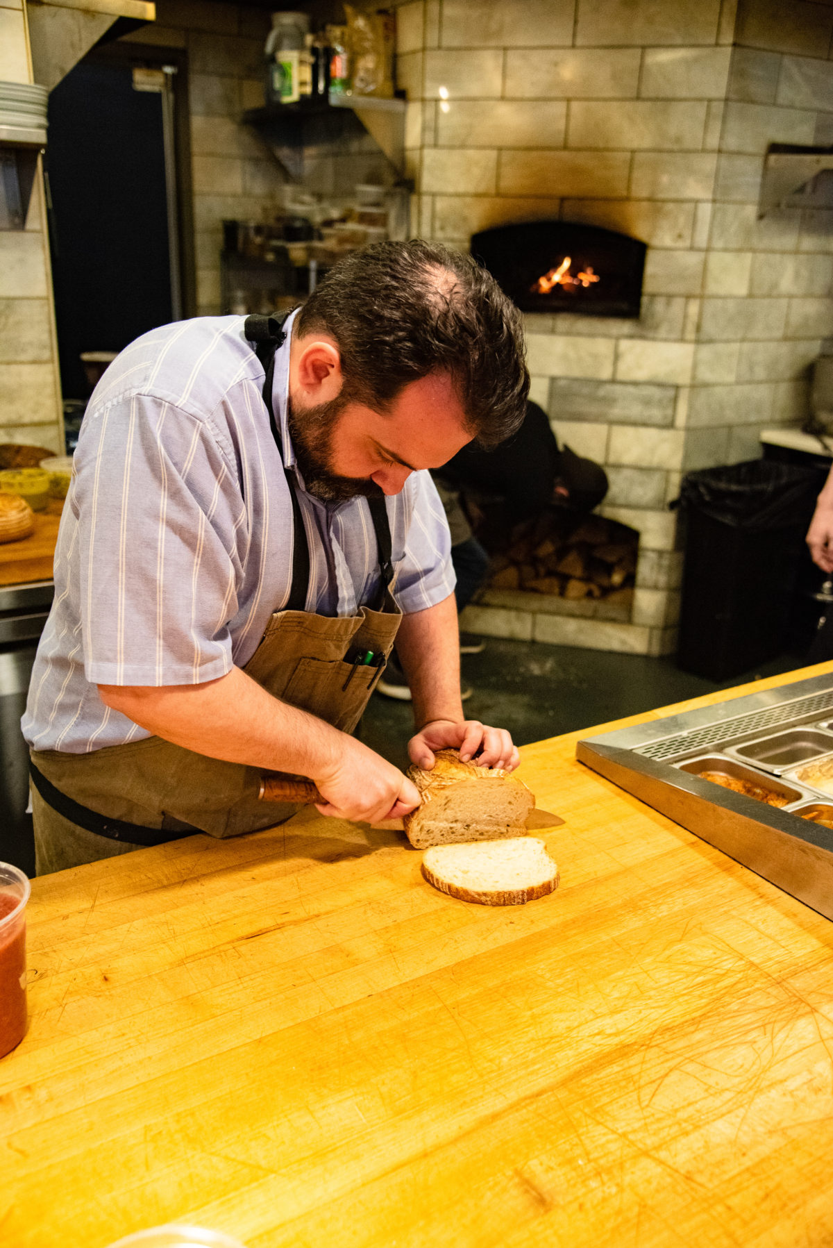 Chef cutting bread slices