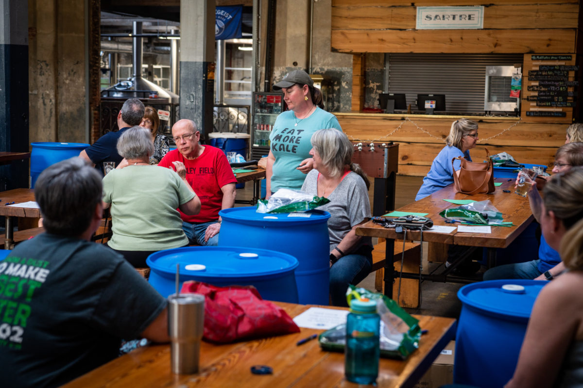 Instructor leading rain barrel making workshop