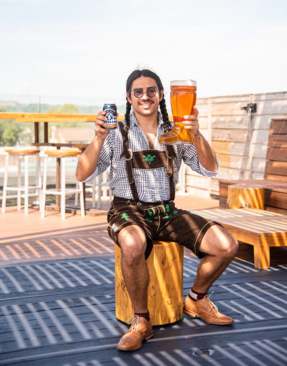 Man dressed for Oktoberfest with beer