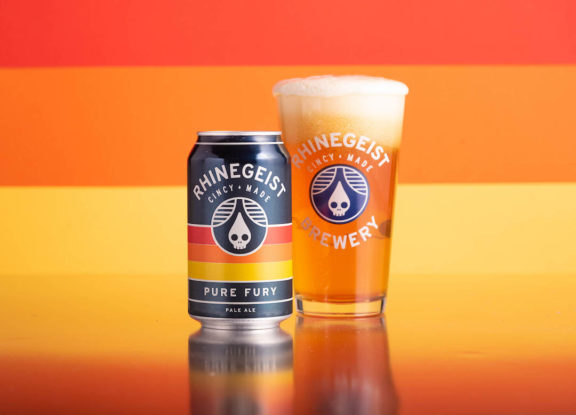 Rhinegeist Pure Fury can next to full pint glass