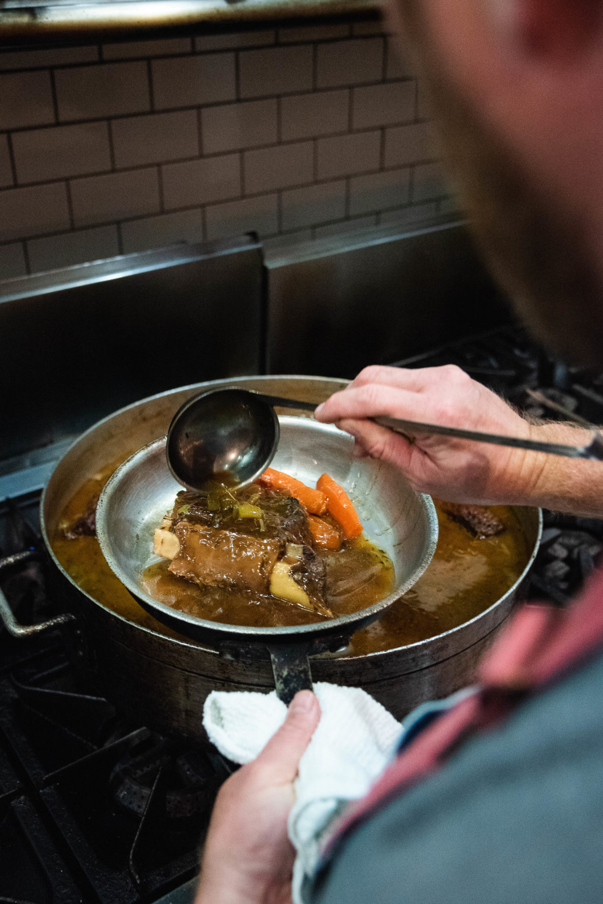 transferring food from pot to smaller pan